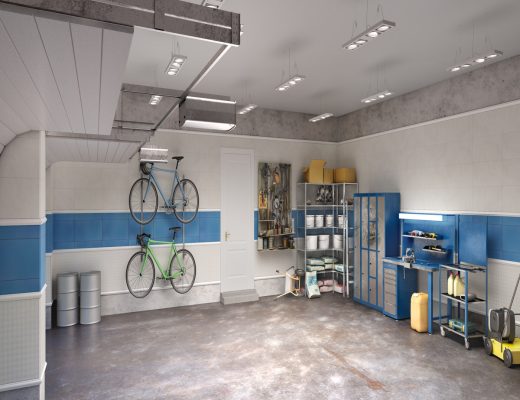A large, organized garage features blue and white walls, with shelves, workstations, and bicycles hanging neatly on one wall.