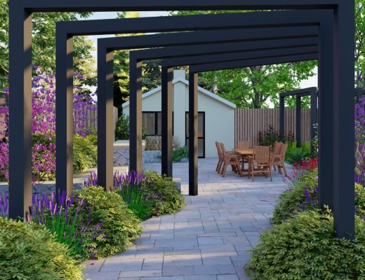 A long stone paver walkway lined with tall black pergolas in a residential backyard during the daytime.